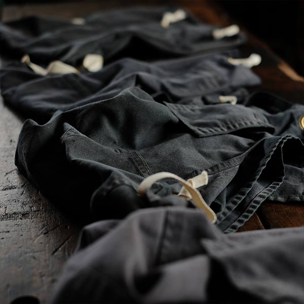 Faded navy blue work apron