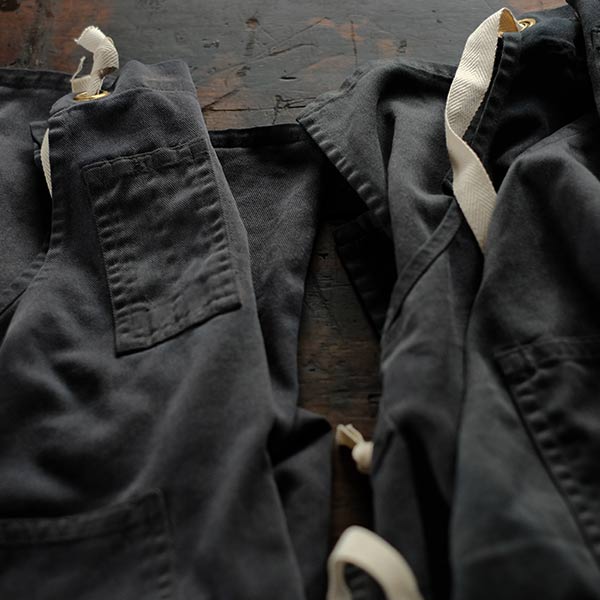 Faded navy blue work apron