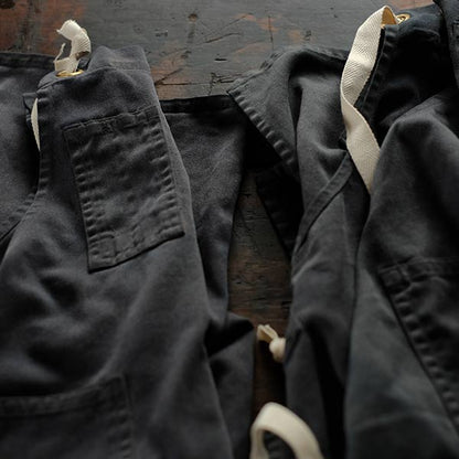 Faded navy blue work apron