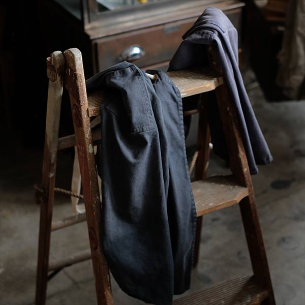 Faded navy blue work apron