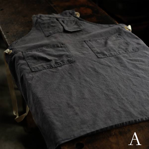 Faded navy blue work apron