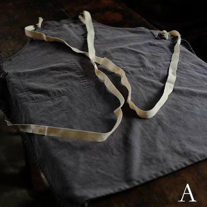 Faded navy blue work apron
